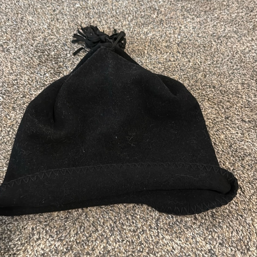 Wool hat with leather tassel